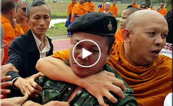 Thai monks fighting with the army